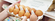 Woman inspecting a carton of brown eggs at the grocery store